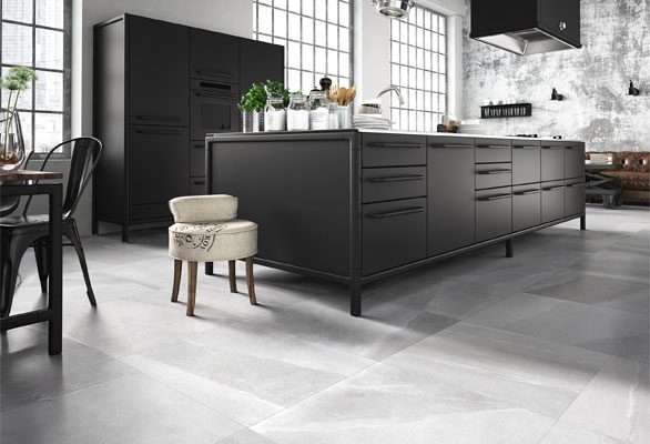 mineral light grey large format floor tiles in a modern kitchen settings