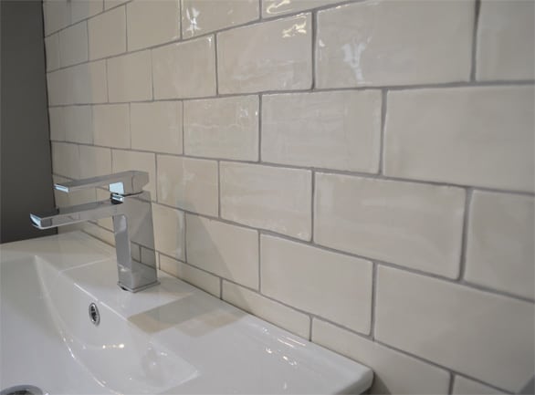 White brick tiles used behind a bathroom sink 