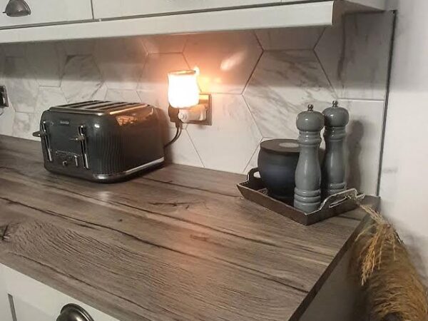 Marble effect tiles set as a kitchen splashback